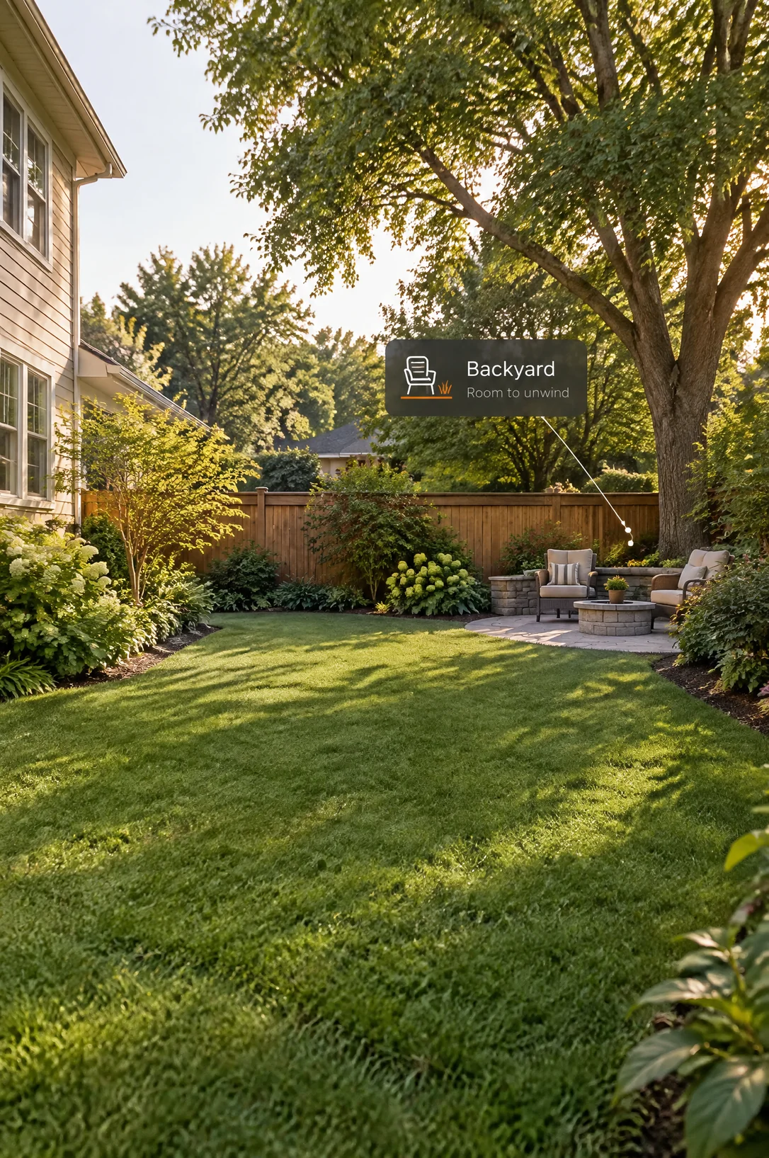 AI backyard concept with an open lawn, perimeter planting and a corner seating area